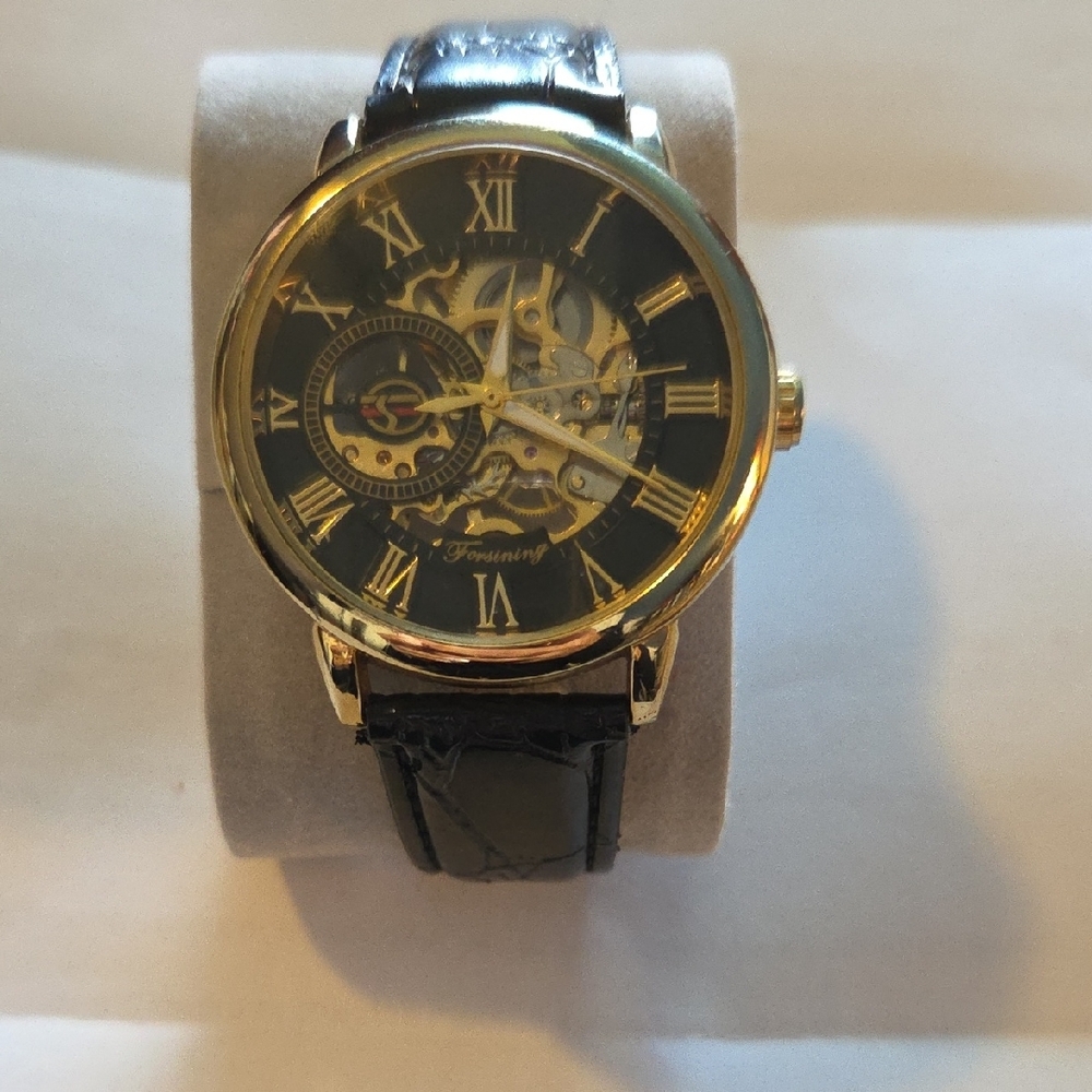 Gold and Black Skeleton Watch